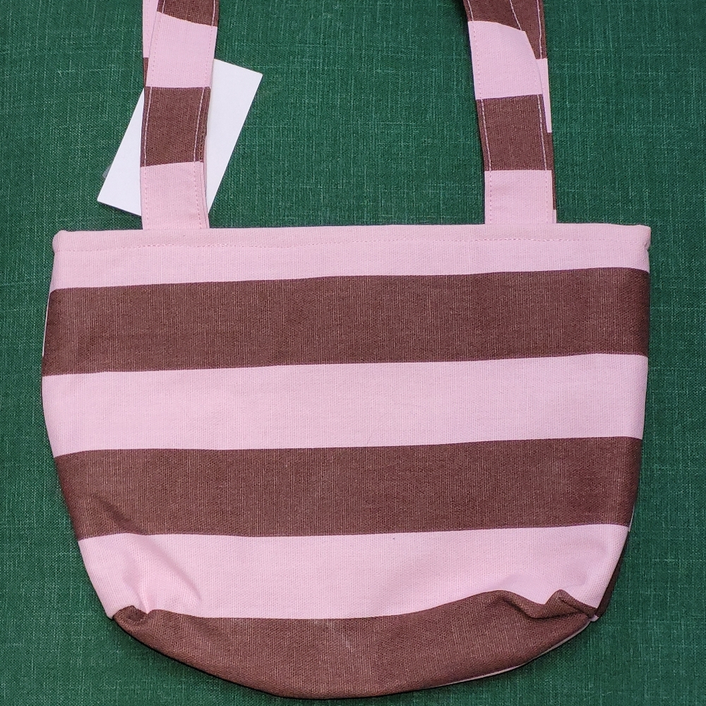 Pink purse with brown stripes.